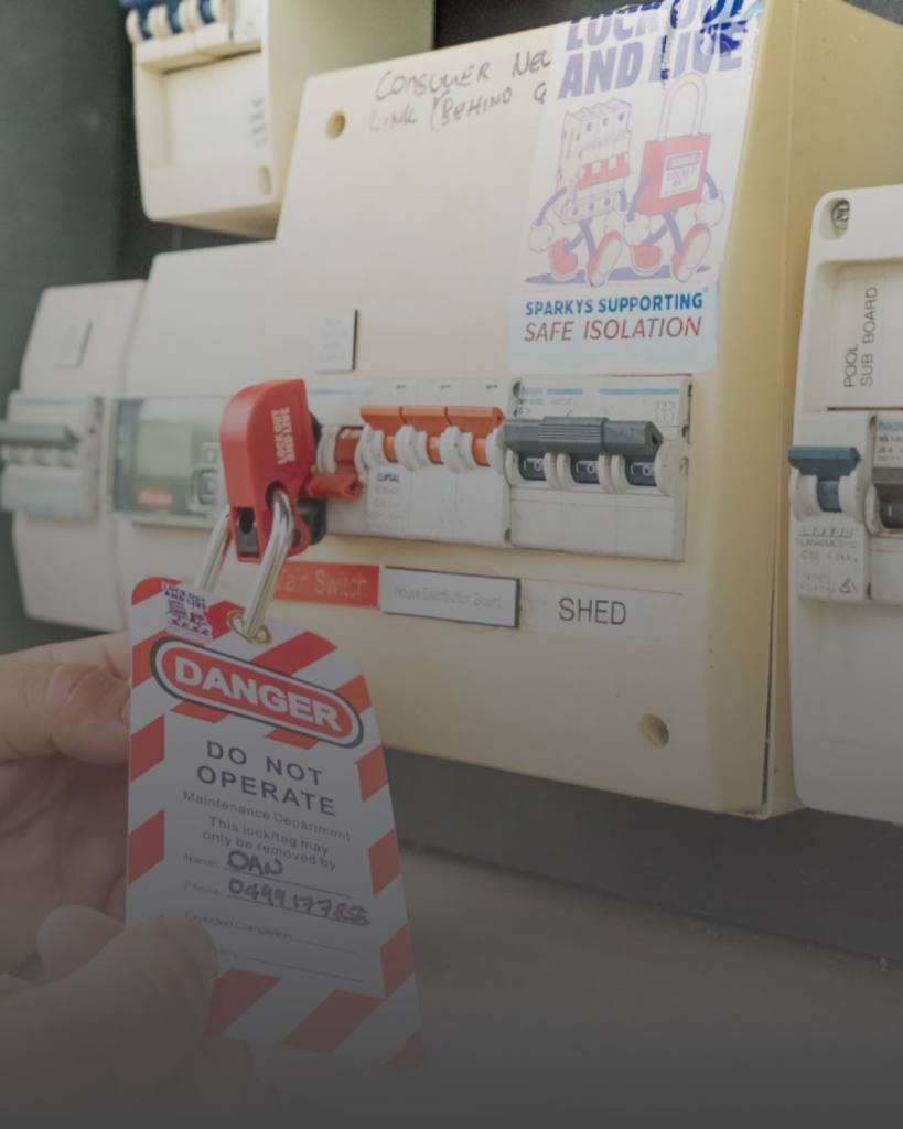 Electrical panel with safety lockout tag indicating "Do Not Operate" for maintenance.