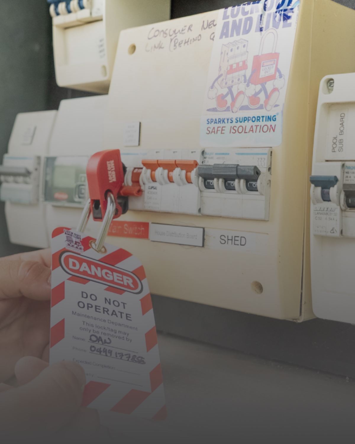 Electrical panel with safety lockout tag indicating "Do Not Operate" for maintenance.
