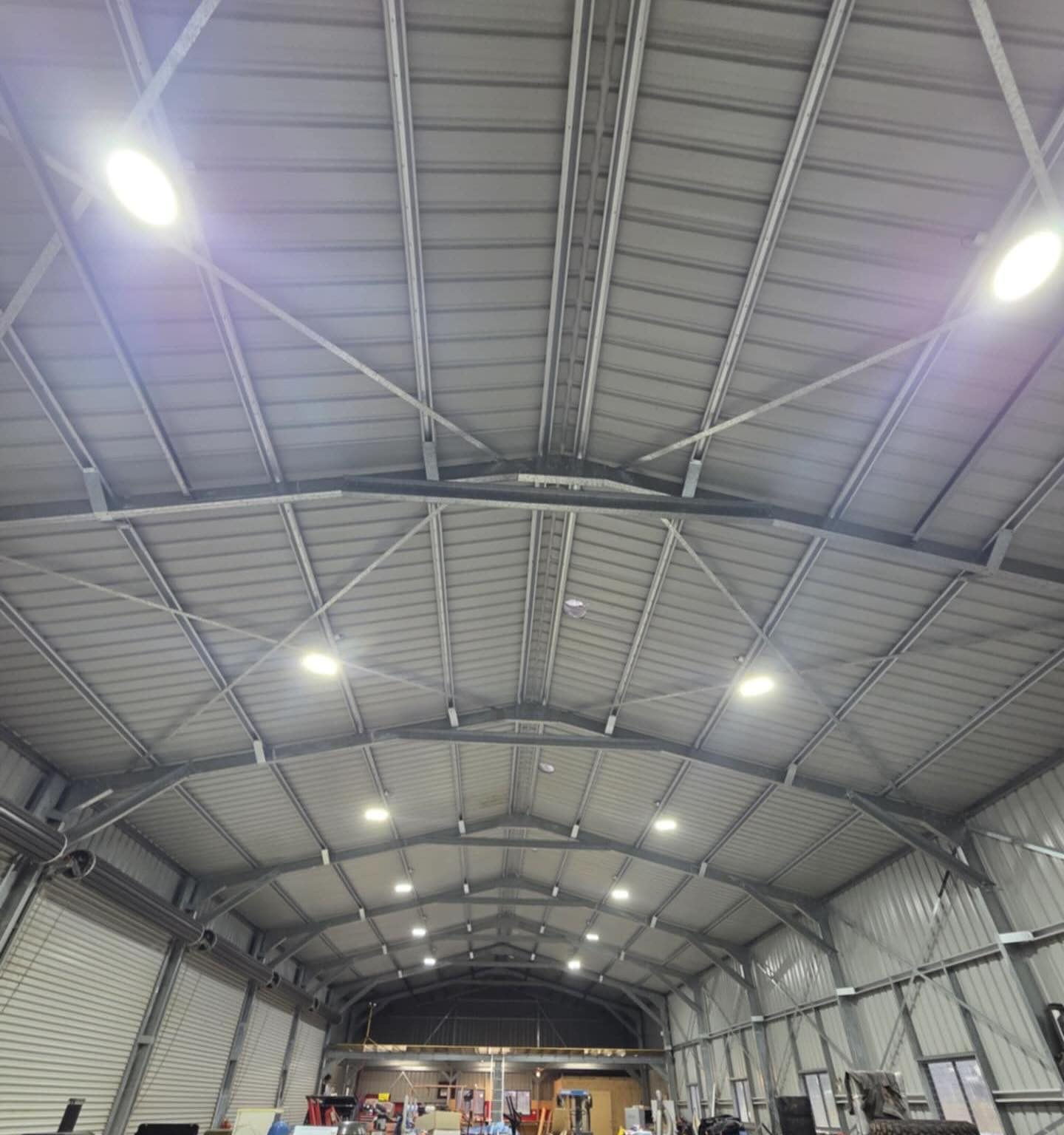 Professional electrician installing electrical systems and cabling in a modern property