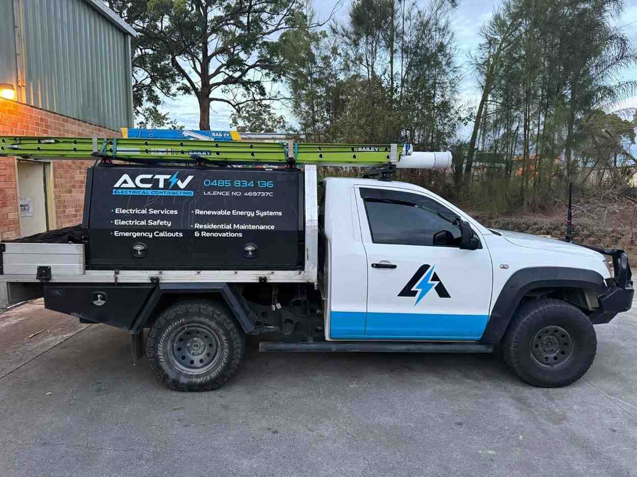 Activ Electrical Contracting utility vehicle with service details displayed on the side.